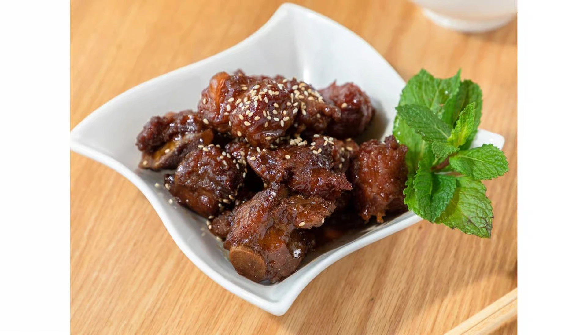 Slow-braised baby back ribs glazed in savory-sweet sauce