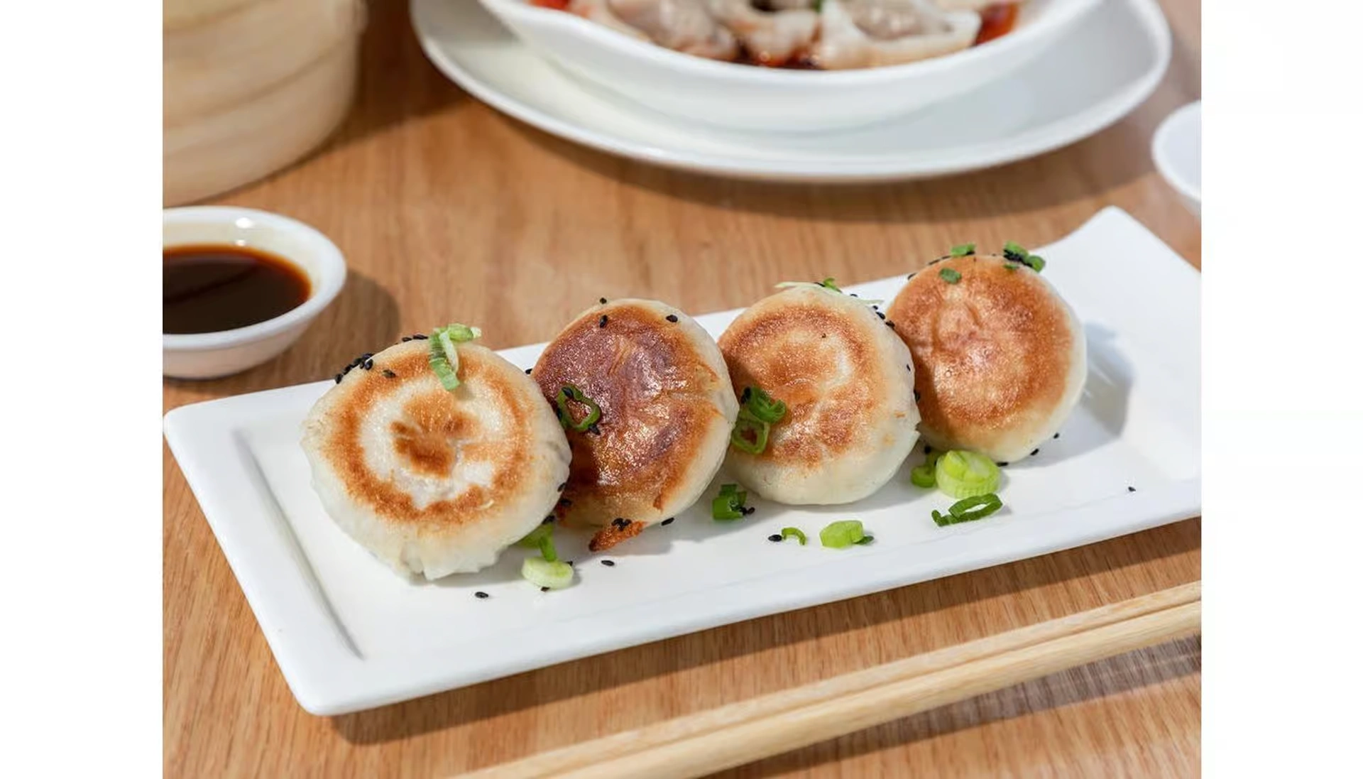 Pan-fried pork buns with golden crisp bottoms