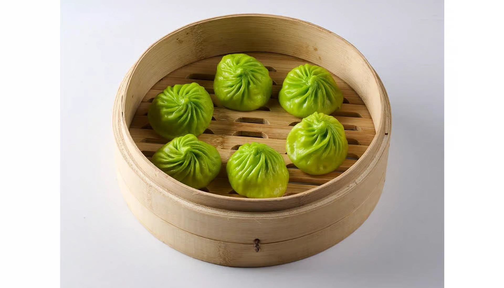 Pork, shrimp and spinach xiaolongbao with green wrapper